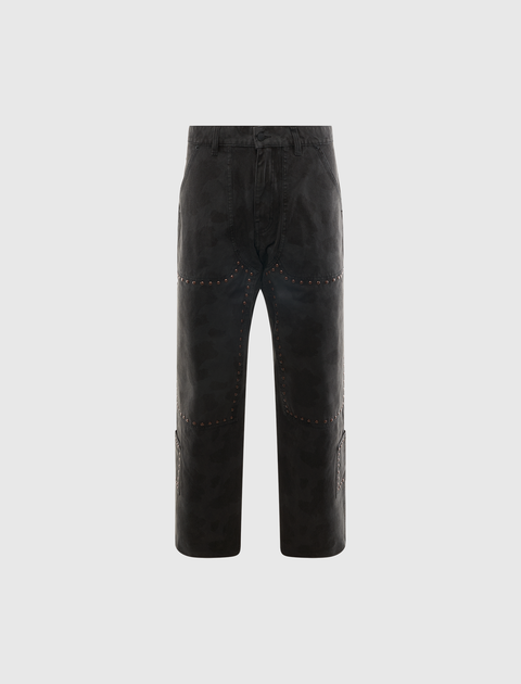 Black men's streetwear pants with subtle camo pattern and studded detailing on front