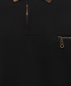 Close-up of black streetwear shirt with plaid collar and front zip pocket detail
