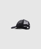 Black mesh trucker hat with adjustable snapback and white embroidery side view
