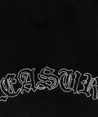 Black knit beanie with white embroidered gothic-style lettering detail