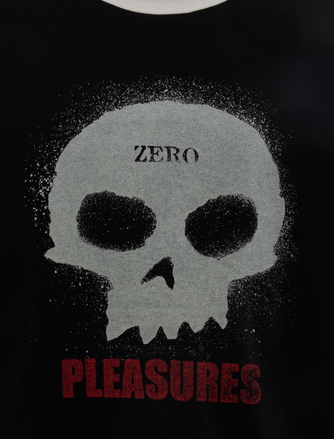 Black streetwear shirt with white skull graphic, 'ZERO' text, and red 'PLEASURES' lettering