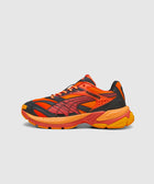 Red and orange mesh athletic sneaker with black accents and textured sole on white background