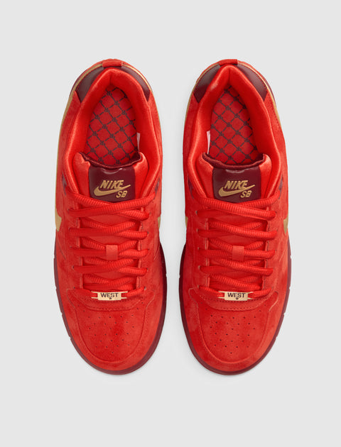 Red Nike SB sneakers with gold accents and patterned insoles, top view