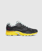 Black mesh sneaker with yellow sole, light blue laces, and Tokyo text on the heel