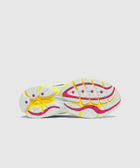 Sneaker outsole with white, yellow, and pink tread, athletic running shoe detail