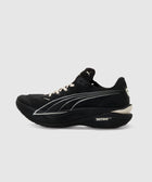 Black running sneaker with white accents, thick cushioned sole, side logo, and Nitro Elite branding