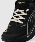 Close-up of black running sneaker with white laces and Ultrafweave detailing