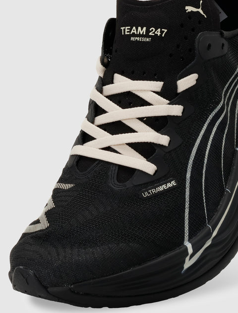 Close-up of black running sneaker with white laces and Ultrafweave detailing