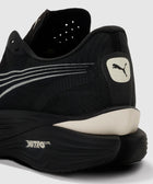 Close-up of black running sneaker heel with white Puma logo and Nitro Elite sole.