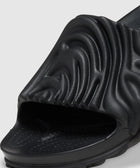Black textured slide sandal with sculpted upper and open toe on a white background