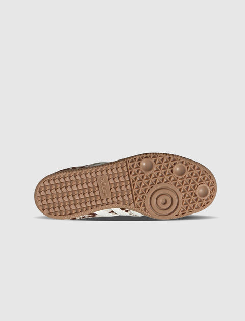 Brown rubber sneaker sole with circular traction pattern on a white background