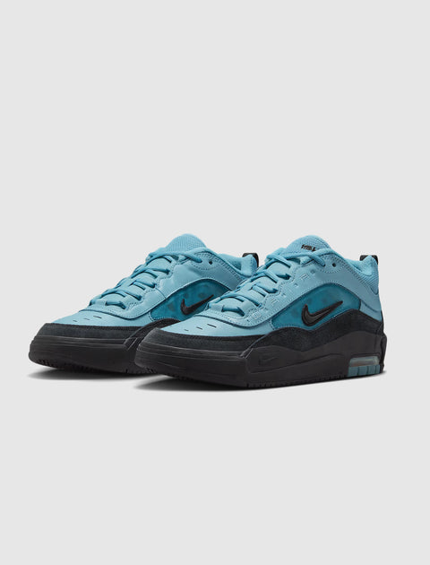 Light blue and black men's sneakers with mesh and suede details on a white background