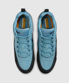 Top view of light blue and black men's sneakers with ISHOD branding on insoles