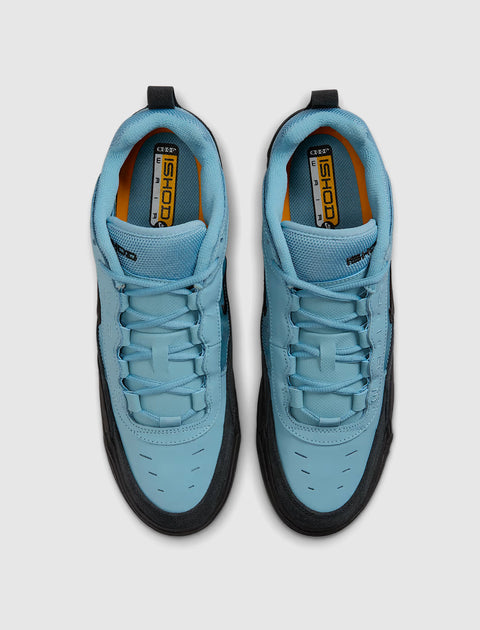 Top view of light blue and black men's sneakers with ISHOD branding on insoles