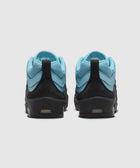 Back view of blue and black Nike Air Max sneakers with turquoise accents on white background