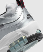 Close-up of metallic silver sneaker heel with visible air cushion and black outsole