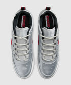 Metallic silver and varsity red low-top sneakers with white laces, top view