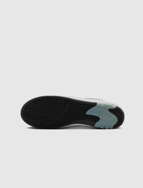 Black sneaker outsole with translucent blue section and textured tread pattern