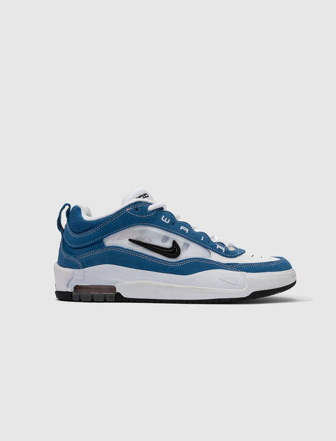 Blue and white low-top sneaker with visible air unit, black swoosh logo, and white laces