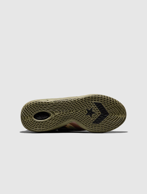 Close-up of khaki sneaker sole with star and arrow pattern, streetwear sneaker detail
