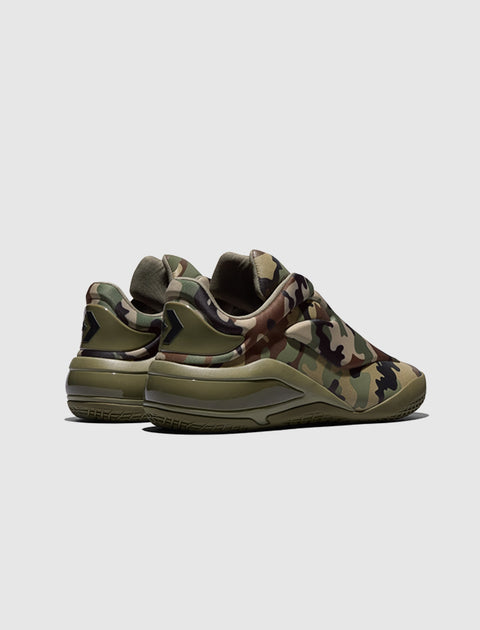 Men's sneakers in green camouflage print with black accents, side and rear view.