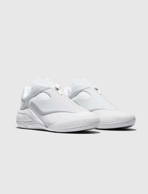 All-white slip-on men's sneakers with zipper closure, modern athletic design
