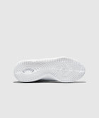 White sneaker outsole with star traction pattern on light gray background