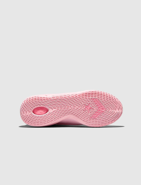 Pink sneaker sole with textured grip pattern and star logo on a light background