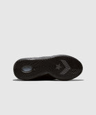 Black sneaker outsole with textured grip pattern and star chevron logo on light background