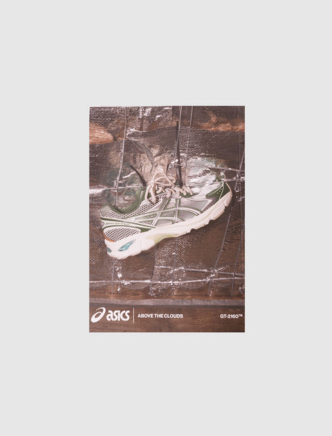 ASICS Above the Clouds GT-2160 green and white sneaker on reflective backdrop