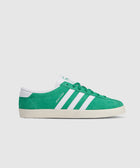 Green and white suede low-top sneaker with white stripes and Sporty & Rich text on side