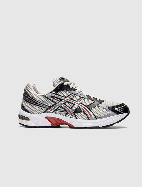 Men's athletic sneaker in smoke grey, pure silver, and red mesh with white sole, side view