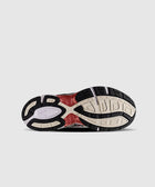 Streetwear sneaker outsole with black, beige, and red tread pattern on white background