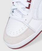 White leather sneaker with beige suede toe, maroon accents, perforated upper, and white laces