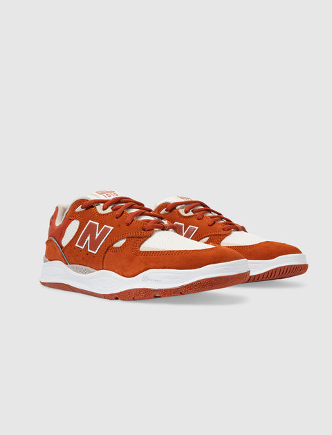 Rust orange and white low-top sneakers with suede and mesh upper, side N logo