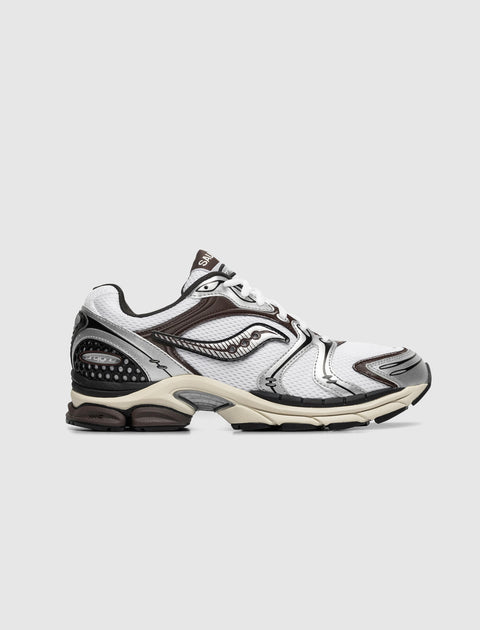 White and silver men's streetwear sneaker with mesh upper and black sole on neutral background