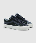 Low-top sneakers with cheetah and dried kelp pattern, black laces, and white sole
