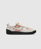 White and orange mesh low-top sneaker with black sole, streetwear style, side view