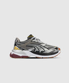 Gray and silver mesh athletic sneaker with black accents, yellow details, and white sole