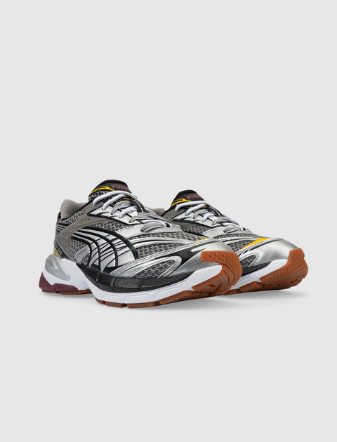 Men's metallic silver and black mesh sneakers with gum soles and athletic design