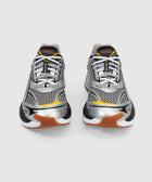Pair of silver mesh and leather sneakers with black, yellow, and gum accents on a white background