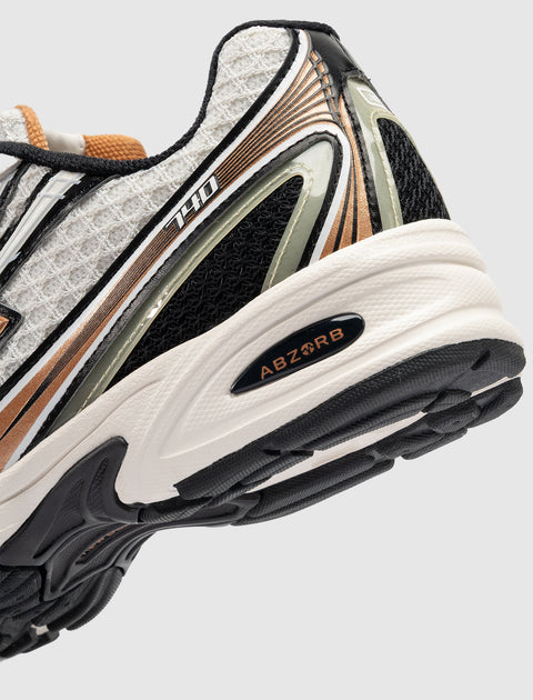 Close-up of a men's sneaker heel with ABZORB cushioning, mesh and synthetic details, labeled 740.