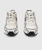 Front view of white mesh and leather sneakers with black accents and N logo on soles