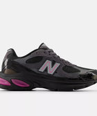 Dark grey and black men's streetwear sneaker with pink accents and mesh panels