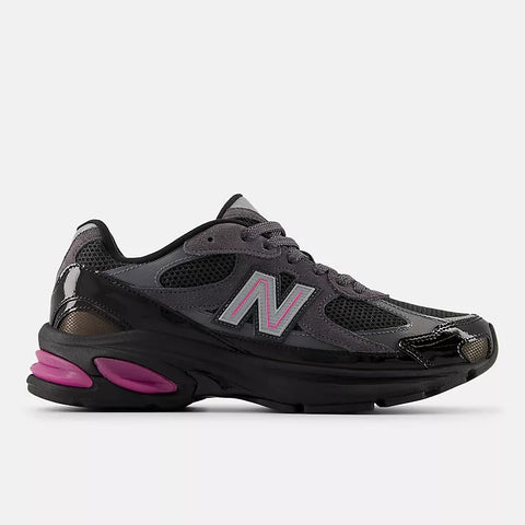Dark grey and black men's streetwear sneaker with pink accents and mesh panels