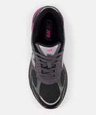 Top view of a black and grey mesh sneaker with pink accents and laces