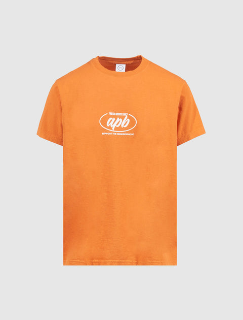 Orange streetwear t-shirt with white chest graphic and short sleeves on plain background