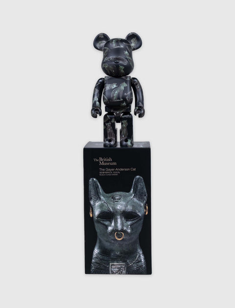 Bearbrick figure with cat statue pattern, standing on box featuring Gayer-Anderson Cat design