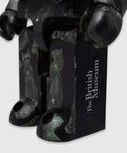 Close-up of collectible figure with ancient Egyptian cat art and 'The British Museum' text