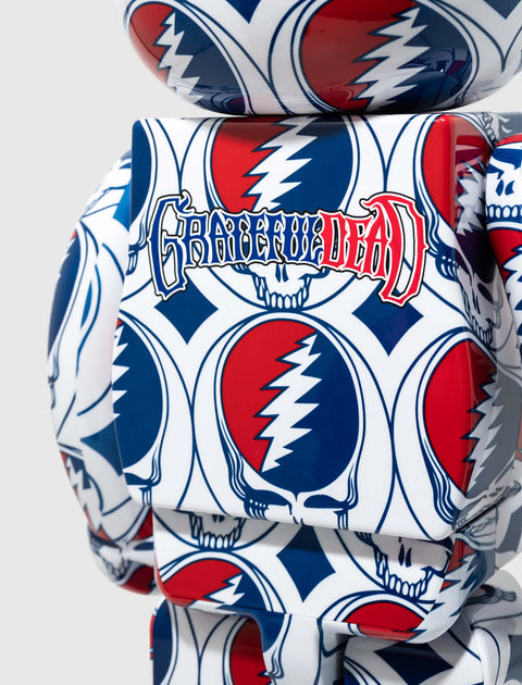 Red, white, and blue Grateful Dead themed collectible toy with skull and lightning patterns